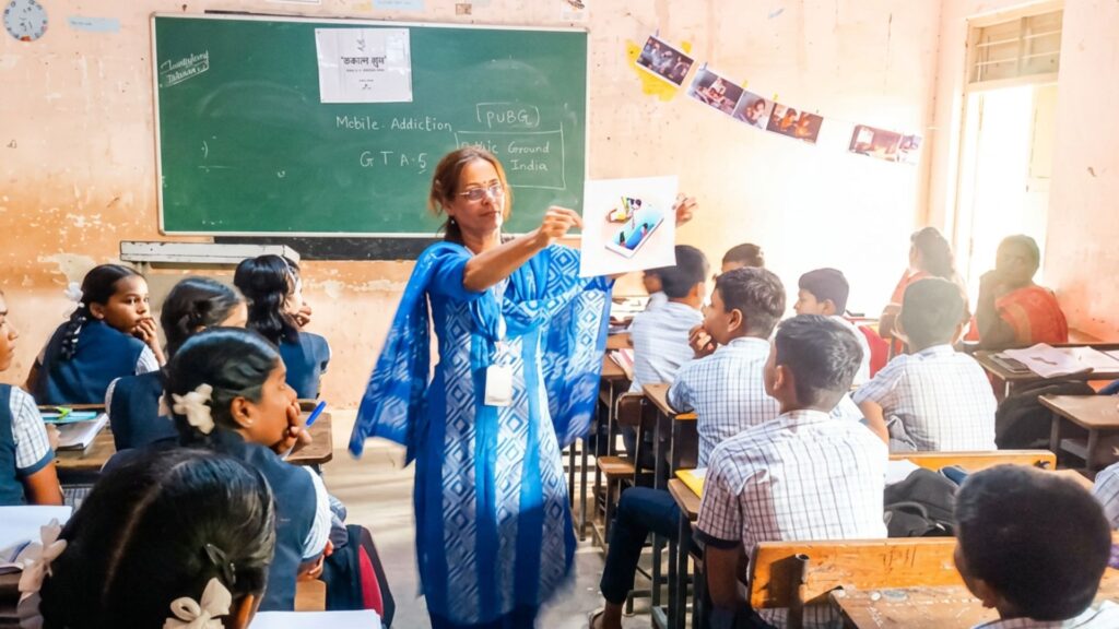 Facilitator teaching a classroom of students — Program Dhruv