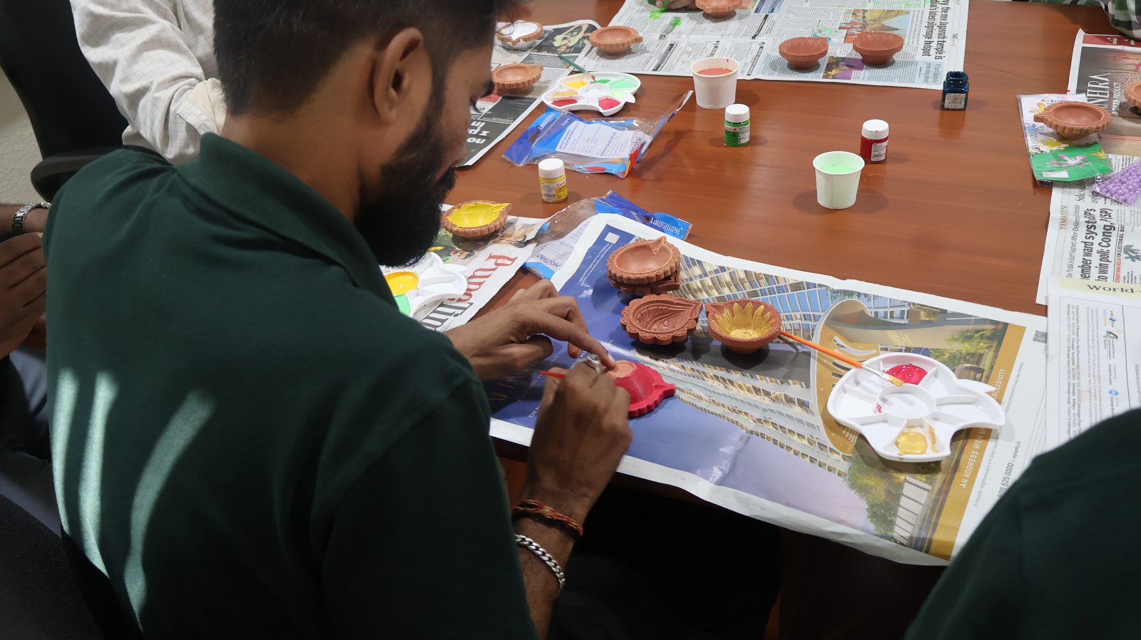 Artemyn India volunteers in a hands-on making session.